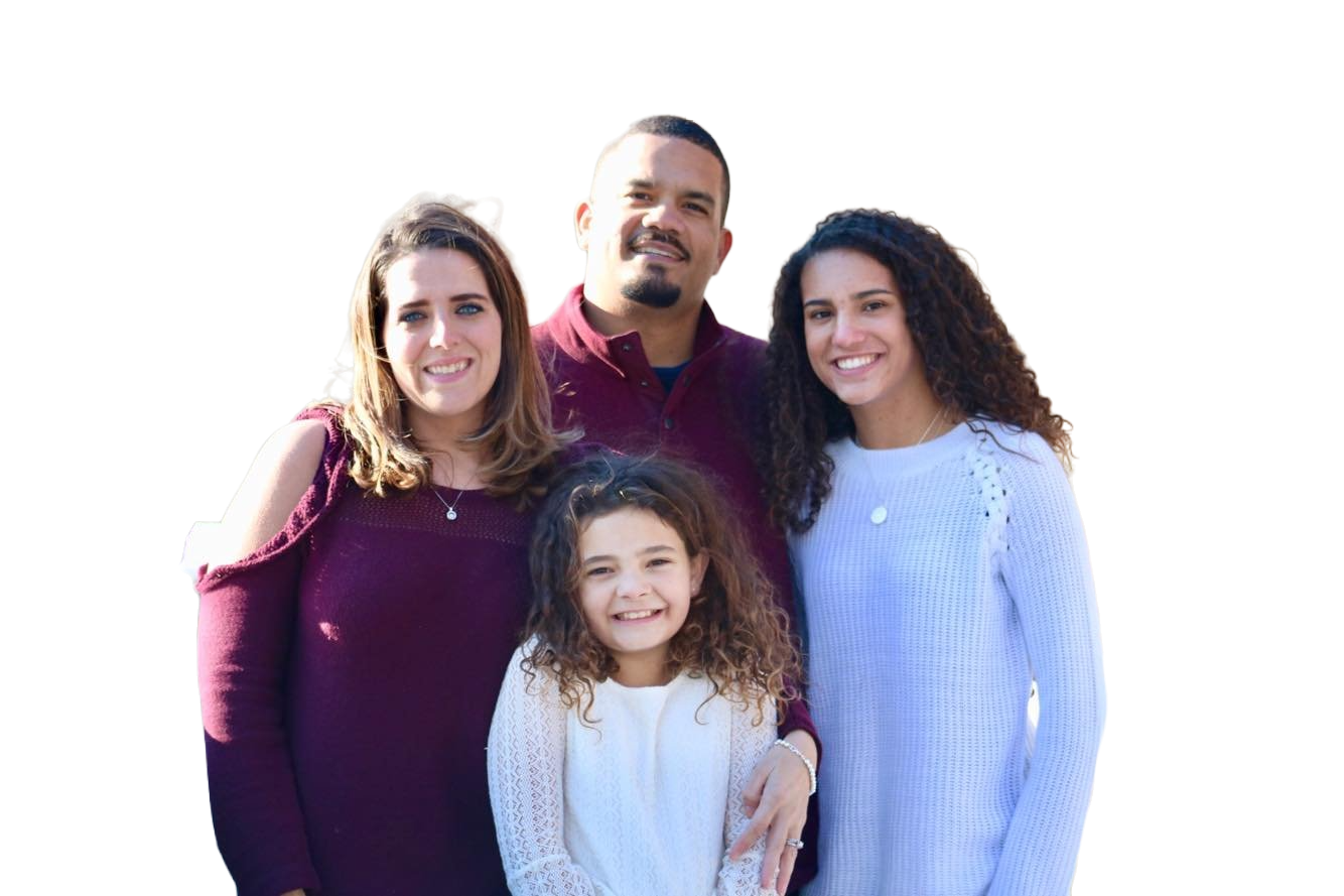 A smiling family of the owner of A Plus Exterior, standing outside in front of a house. Caption: Meet the family behind A Plus Exterior! Our dedicated team is family-owned and operated, and we take pride in treating our clients like family too. When you work with us, you can expect a personalized approach to your exterior services needs, and a commitment to delivering exceptional results.